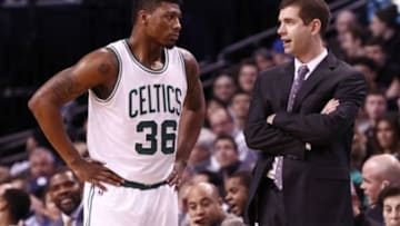 Jan 30, 2015; Boston, MA, USA; Boston Celtics head coach Brad Stevens (right) speaks to guard Marcus Smart (36) during the second half of a game against the Houston Rockets at TD Garden. Mandatory Credit: Mark L. Baer-USA TODAY Sports