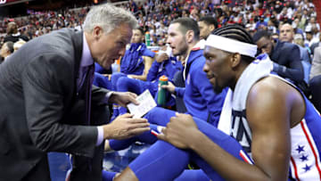 WASHINGTON, DC - OCTOBER 18: Head coach Brett Brown of the Philadelphia 76er talks with Joel Embiid