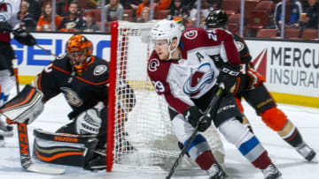 ANAHEIM, CA - APRIL 1: Nathan MacKinnon #29 of the Colorado Avalanche brings the puck around the net guarded by goalie Ryan Miller #30 of the Anaheim Ducks during the second period of the game at Honda Center on April 1, 2018 in Anaheim, California. (Photo by Debora Robinson/NHLI via Getty Images) *** Local Caption ***
