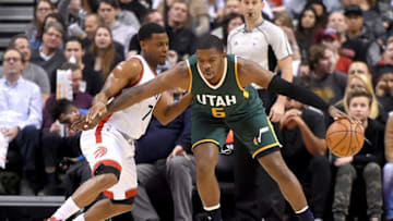 Jan 5, 2017; Toronto, Ontario, CAN; Utah Jazz forward Joe Johnson (6) fends off Toronto Raptors guard Kyle Lowry (7) in the first half at Air Canada Centre. Mandatory Credit: Dan Hamilton-USA TODAY Sports