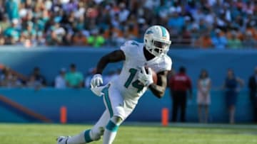 Dec 7, 2014; Miami Gardens, FL, USA; Miami Dolphins wide receiver Jarvis Landry (14) runs against the Baltimore Ravens during the second half at Sun Life Stadium. Ravens won 28-13. Mandatory Credit: Steve Mitchell-USA TODAY Sports