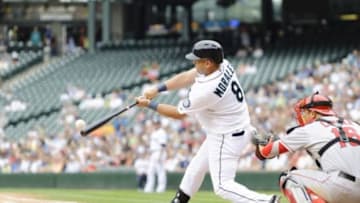 Aug 25, 2013; Seattle, WA, USA; Seattle Mariners designated hitter Kendrys Morales (8) hits a single against the Los Angeles Angels during the 4th inning at Safeco Field. Mandatory Credit: Steven Bisig-USA TODAY Sports