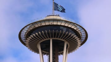 SEATTLE, WASHINGTON - JULY 23: A general view of the Space Needle as the Seattle Kraken team flag is hung from above on July 23, 2020 in Seattle, Washington. The NHL revealed the franchise's new team name today. (Photo by Abbie Parr/Getty Images)