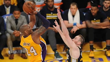 April 13, 2016; Los Angeles, CA, USA; Los Angeles Lakers forward Kobe Bryant (24) shoots against Utah Jazz forward Gordon Hayward (20) during the second half at Staples Center. Mandatory Credit: Gary A. Vasquez-USA TODAY Sports