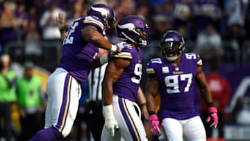 MINNEAPOLIS, MN - OCTOBER 22: Tom Johnson #92 of the Minnesota Vikings jumps on the back of teammate Danielle Hunter to celebrate a sack in the first quarter of the game against the Baltimore Ravens on October 22, 2017 at U.S. Bank Stadium in Minneapolis, Minnesota. (Photo by Hannah Foslien/Getty Images)