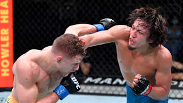 LAS VEGAS, NEVADA - AUGUST 28: (R-L) Ricky Turcios punches b in a bantamweight fight during the UFC Fight Night event at UFC APEX on August 28, 2021 in Las Vegas, Nevada. (Photo by Chris Unger/Zuffa LLC)