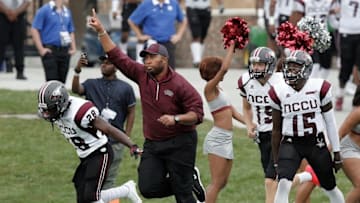 Sep 12, 2015; Durham, NC, USA; North Carolina Central Eagles head coach Jerry Mack leads his players onto the field before the start of their game against the Duke Blue Devils at Wallace Wade Stadium. Mandatory Credit: Mark Dolejs-USA TODAY Sports