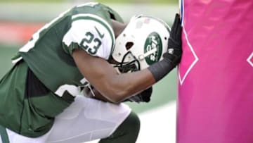 Oct 13, 2013; East Rutherford, NJ, USA; New York Jets running back Mike Goodson (23) prays before the first half prior to facing the Pittsburgh Steelers at MetLife Stadium. Mandatory Credit: Joe Camporeale-USA TODAY Sports