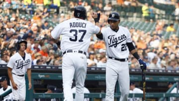 DETROIT, MI - AUGUST 11: Jim Adduci #37 of the Detroit Tigers celebrates with Victor Reyes #22 of the Detroit Tigers after scoring against the Minnesota Twins on a hit by James McCann of the Detroit Tigers during the second inning at Comerica Park on August 11, 2018 in Detroit, Michigan. The Twins defeated the Tigers 4-3. The Tigers are wearing uniforms with "Tigres" on the chest in honor of our Fiesta Tigres celebration tonight.(Photo by Duane Burleson/Getty Images)