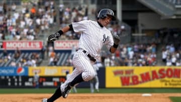August 20, 2013; Bronx, NY, USA; New York Yankees outfielder Ichiro Suzuki rounds third base on his way to scoring against the Toronto Blue Jays at Yankee Stadium. Mandatory Credit: John Munson/THE STAR-LEDGER via USA TODAY Sports