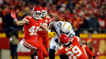 KANSAS CITY, MISSOURI - DECEMBER 13: Tight end Antonio Gates #85 of the Los Angeles Chargers is tackled by defensive back Eric Berry #29 of the Kansas City Chiefs after making a catch during the game at Arrowhead Stadium on December 13, 2018 in Kansas City, Missouri. (Photo by David Eulitt/Getty Images)