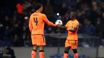 PORTO, PORTUGAL - FEBRUARY 14: Sadio Mane of Liverpool receives the match ball from Virgil van Dijk of Liverpool after scoring hatrick after the UEFA Champions League Round of 16 First Leg match between FC Porto and Liverpool at Estadio do Dragao on February 14, 2018 in Porto, Portugal. (Photo by Julian Finney/Getty Images)