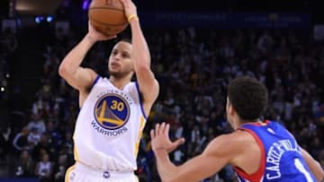 December 30, 2014; Oakland, CA, USA; Golden State Warriors guard Stephen Curry (30) shoots the basketball against the Philadelphia 76ers during the third quarter at Oracle Arena. The Warriors defeated the 76ers 126-86. Mandatory Credit: Kyle Terada-USA TODAY Sports