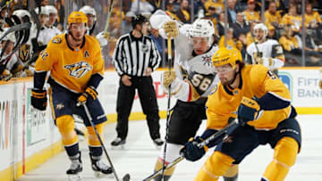 NASHVILLE, TN - OCTOBER 30: Filip Forsberg #9 of the Nashville Predators battles for the puck against Erik Haula #56 of the Vegas Golden Knights at Bridgestone Arena on October 30, 2018 in Nashville, Tennessee. (Photo by John Russell/NHLI via Getty Images)