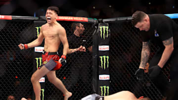 SINGAPORE, SINGAPORE - JUNE 12: Hayisaer Maheshate of China celebrates after knocking out Steve Garcia of the United States in their lightweight bout during UFC 275 at Singapore Indoor Stadium on June 12, 2022 in Singapore. (Photo by Yong Teck Lim/Getty Images)