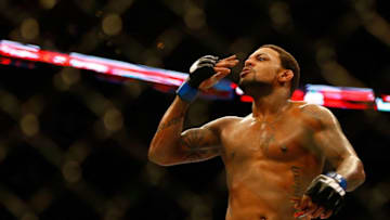 BOSTON, MA - AUGUST 17: Michael Johnson celebrates following his win against Joe Lauzon in their middleweight bout at TD Garden on August 17, 2013 in Boston, Massachusetts. (Photo by Jared Wickerham/Getty Images)