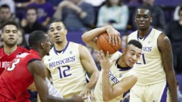 Dec 7, 2014; Seattle, WA, USA; Washington Huskies guard Nigel Williams-Goss (5) collects a rebound next to Washington Huskies guard Andrew Andrews (12) during the first half against the San Diego State Aztecs at Alaska Airlines Arena. Mandatory Credit: Joe Nicholson-USA TODAY Sports