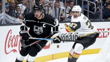 LOS ANGELES, CA - OCTOBER 13: Anze Kopitar #11 of the Los Angeles Kings and Shea Theodore #27 of the Vegas Golden Knights battle for position during the third period of the game at STAPLES Center on October 13, 2019 in Los Angeles, California. (Photo by Juan Ocampo/NHLI via Getty Images)