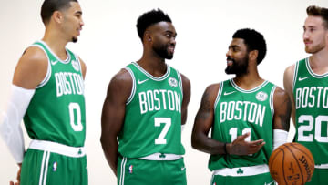 CANTON, MA - SEPTEMBER 24: From left, Jayson Tatum #0, Jaylen Brown #7, Kyrie Irving #11 and Gordon Hayward #20 talk together during a photoshoot on Boston Celtics Media Day on September 24, 2018 in Canton, Massachusetts. NOTE TO USER: User expressly acknowledges and agrees that, by downloading and/or using this photograph, user is consenting to the terms and conditions of the Getty Images License Agreement. (Photo by Maddie Meyer/Getty Images)
