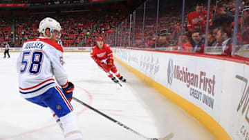 DETROIT, MI - APRIL 05: Noah Juulsen #58 of the Montreal Canadiens skates after a loose puck in the corner in front of Tyler Bertuzzi #59 of the Detroit Red Wings during an NHL game at Little Caesars Arena on April 5, 2018 in Detroit, Michigan. The Canadiens defeated the Wings 4-3. (Photo by Dave Reginek/NHLI via Getty Images) *** Local Caption *** Noah Juulsen; Tyler Bertuzzi