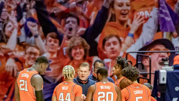 Feb 16, 2021; Champaign, Illinois, USA; Illinois Fighting Illini head coach Brad Underwood talks with center Kofi Cockburn (21) and guard Adam Miller (44) and guard Da'Monte Williams (20) and guard Andre Curbelo (5) and guard Ayo Dosunmu (11) during the second half at the State Farm Center. Mandatory Credit: Patrick Gorski-USA TODAY Sports