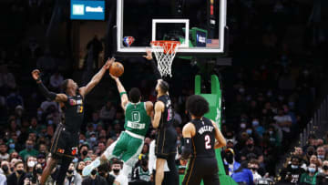 Jayson Tatum #0 of the Boston Celtics goes to the basket against Bam Adebayo #13 and Caleb Martin #16 of the Miami Heat(Photo by Omar Rawlings/Getty Images)