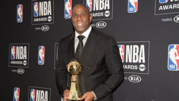 June 24, 2019; Los Angeles, CA, USA; NBA former player Magic Johnson poses with his lifetime achievement award at the 2019 NBA Awards show at Barker Hanger. Mandatory Credit: Gary A. Vasquez-USA TODAY Sports