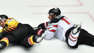Germany's Bernhard Ebner (L) and Canada's Jaden Schwartz fall down during the group B match Canada v Germany of the 2018 IIHF Ice Hockey World Championship at the Jyske Bank Boxen in Herning, Denmark, on May 15, 2018. (Photo by JOE KLAMAR / AFP) (Photo credit should read JOE KLAMAR/AFP/Getty Images)
