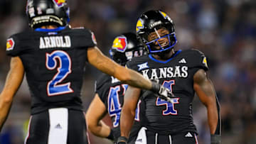 Sep 8, 2023; Lawrence, Kansas, USA; Kansas Jayhawks running back Devin Neal (4) reacts after a first down against the Illinois Fighting Illini during the second half at David Booth Kansas Memorial Stadium. Mandatory Credit: Jay Biggerstaff-USA TODAY Sports