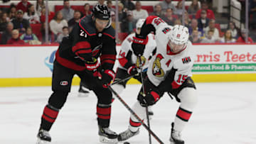RALEIGH, NC - JANUARY 18: Carolina Hurricanes right wing Nino Niederreiter (21) tries for the puck while eOttawa Senators left wing Zack Smith (15) stick breaks during the 1st period of the Carolina Hurricanes game versus the Ottawa Senators on January 18th, 2019 at PNC Arena in Raleigh, NC. (Photo by Jaylynn Nash/Icon Sportswire via Getty Images)