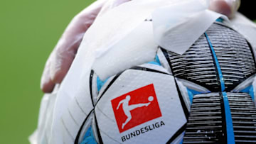 BREMEN, GERMANY - MAY 18: An employee of Werder Bremen disinfects an official match ball ahead of the Bundesliga match between SV Werder Bremen and Bayer 04 Leverkusen at Wohninvest Weserstadion on May 18, 2020 in Bremen, Germany. The Bundesliga and Second Bundesliga is the first professional league to resume the season after the nationwide lockdown due to the ongoing Coronavirus (COVID-19) pandemic. All matches until the end of the season will be played behind closed doors. (Photo by Stuart Franklin/Getty Images)