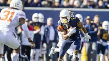 Nov 14, 2015; Morgantown, WV, USA; West Virginia Mountaineers wide receiver Ka'Raun White makes a catch over the middle of the field during the second quarter against the Texas Longhorns at Milan Puskar Stadium. Mandatory Credit: Ben Queen-USA TODAY Sports