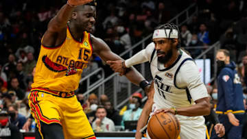 Nov 4, 2021; Atlanta, Georgia, USA; Utah Jazz guard Mike Conley (11) dribbles defended by Atlanta Hawks center Clint Capela (15) during the second half at State Farm Arena. Mandatory Credit: Dale Zanine-USA TODAY Sports