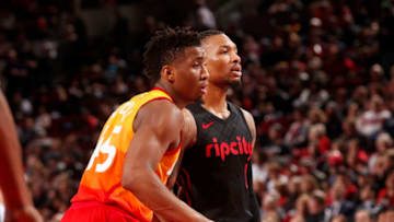 PORTLAND, OR - FEBRUARY 11: Damian Lillard #0 of the Portland Trail Blazers and Donovan Mitchell #45 of the Utah Jazz look on during the game on February 11, 2018 at the Moda Center in Portland, Oregon. NOTE TO USER: User expressly acknowledges and agrees that, by downloading and or using this Photograph, user is consenting to the terms and conditions of the Getty Images License Agreement. Mandatory Copyright Notice: Copyright 2018 NBAE (Photo by Cameron Browne/NBAE via Getty Images)