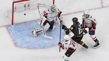 LAS VEGAS, NEVADA - FEBRUARY 17: Reilly Smith #19 of the Vegas Golden Knights scores a first-period goal against Braden Holtby #70 of the Washington Capitals as Nicklas Backstrom #19 and Nick Jensen #3 Capitals defend during their game at T-Mobile Arena on February 17, 2020 in Las Vegas, Nevada. (Photo by Ethan Miller/Getty Images)