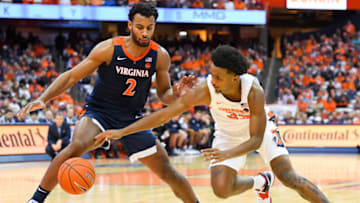 SYRACUSE, NY - NOVEMBER 06: Braxton Key #2 of the Virginia Cavaliers and Elijah Hughes #33 of the Syracuse Orange battle for a loose ball during the second half at the Carrier Dome on November 6, 2019 in Syracuse, New York. Virginia defeated Syracuse 48-34. (Photo by Rich Barnes/Getty Images)