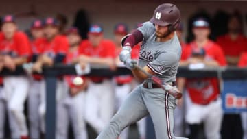 Mississippi State Bulldogs' Luke Hancock makes contact with a pitch against the Ole Miss Rebels at Oxford-University Stadium on Thursday, April 21, 2022.Ole 8