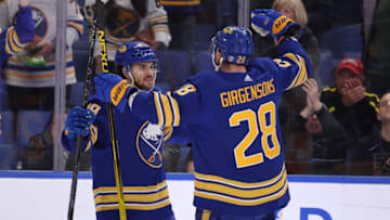 Apr 16, 2022; Buffalo, New York, USA; Buffalo Sabres center Vinnie Hinostroza (29) celebrates his goal with left wing Zemgus Girgensons (28) during the second period against the Philadelphia Flyers at KeyBank Center. Mandatory Credit: Timothy T. Ludwig-USA TODAY Sports