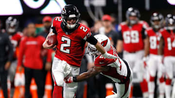 ATLANTA, GA - DECEMBER 16: Matt Ryan #2 of the Atlanta Falcons breaks a tackle by Patrick Peterson #21 of the Arizona Cardinals at Mercedes-Benz Stadium on December 16, 2018 in Atlanta, Georgia. (Photo by Kevin C. Cox/Getty Images)
