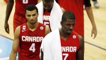 Jul 25, 2015; Toronto, Ontario, CAN; Canada forward Andrew Nicholson (7) and Canada guard Jamal Murphy (4) walk off the court after losing to Brazil to in the men