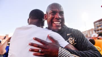 BOULDER, CO - SEPTEMBER 7: Head coach Mel Tucker of the Colorado Buffaloes hugs a fan who had rushed the field after the Colorado Buffaloes 34-31 overtime win over the Nebraska Cornhuskers at Folsom Field on September 7, 2019 in Boulder, Colorado. (Photo by Dustin Bradford/Getty Images)