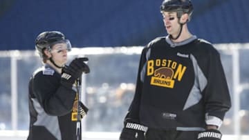 Dec 31, 2015; Foxborough, MA, USA; Boston Bruins defenseman Zdeno Chara (33) talks to defenseman Torey Krug (47) during practice the day prior to the Winter Classic hockey game at Gillette Stadium. Mandatory Credit: Greg M. Cooper-USA TODAY Sports
