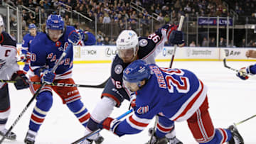 NEW YORK, NEW YORK - OCTOBER 23: Jack Roslovic #96 of the Columbus Blue Jackets takes the faceoff against Chris Kreider #20 of the New York Rangers at Madison Square Garden on October 23, 2022 in New York City. The Blue Jackets defeated the Rangers 5-1. (Photo by Bruce Bennett/Getty Images)