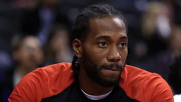 TORONTO, ON - OCTOBER 5: Kawhi Leonard #2 and Danny Green #14 of the Toronto Raptors looks on from the bench during the second half of an NBA preseason game against Melbourne United at Scotiabank Arena on October 5, 2018 in Toronto, Canada. NOTE TO USER: User expressly acknowledges and agrees that, by downloading and or using this photograph, User is consenting to the terms and conditions of the Getty Images License Agreement. (Photo by Vaughn Ridley/Getty Images)
