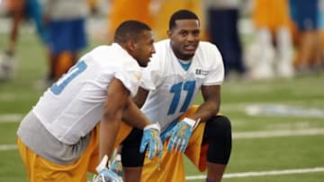 Jun 17, 2014; Davie, FL, USA; Miami Dolphin wider receivers Mike Wallace (right) and Brandon Gibson talk during mini-camp at Miami Dolphins Training Facility. Mandatory Credit: Robert Mayer-USA TODAY Sports