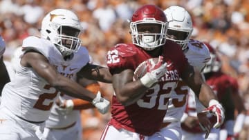 Oct 8, 2016; Dallas, TX, USA; Oklahoma Sooners running back Samaje Perine (32) runs the ball against Texas Longhorns cornerback Kris Boyd (2) in the game at Cotton Bowl. Mandatory Credit: Tim Heitman-USA TODAY Sports
