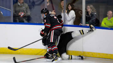 WORCESTER, MA - MARCH 25: Jayden Struble #3 of the Northeastern Huskies checks Ty Glover #27 of the Western Michigan Broncos during the NCAA Men's Ice Hockey Northeast Regional game at the DCU Center on March 25, 2022 in Worcester, Massachusetts. The Broncos won 2-1 in overtime. (Photo by Richard T Gagnon/Getty Images)