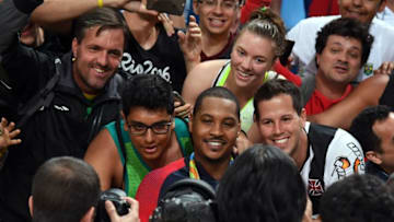 Aug 21, 2016; Rio de Janeiro, Brazil; USA forward Carmelo Anthony (15) poses for pictures with fans after winning the gold medal in the men's gold game during the during the Rio 2016 Summer Olympic Games at Carioca Arena 1. Mandatory Credit: RVR Photos-USA TODAY Sports