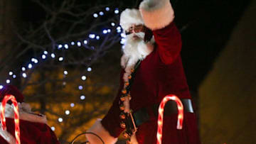 Santa Clause waves at children who gathered for Greater Lafayette's annual Christmas Parade, "A Very Merry Main Street," Saturday, Dec. 3, 2022, in Lafayette, Ind.Np1 1294