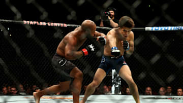 Henry Cejudo and Demetrious Johnson (Photo by Joe Scarnici/Getty Images)